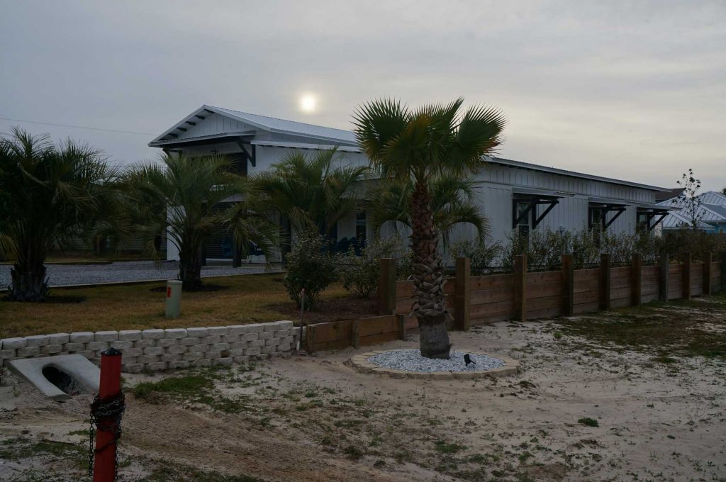 side view of home with large boat garage