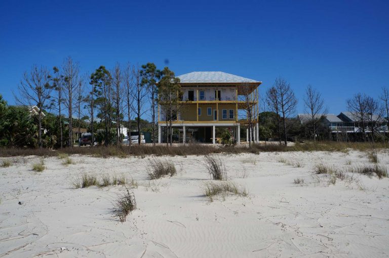 Sand in the front yard goes to beach.