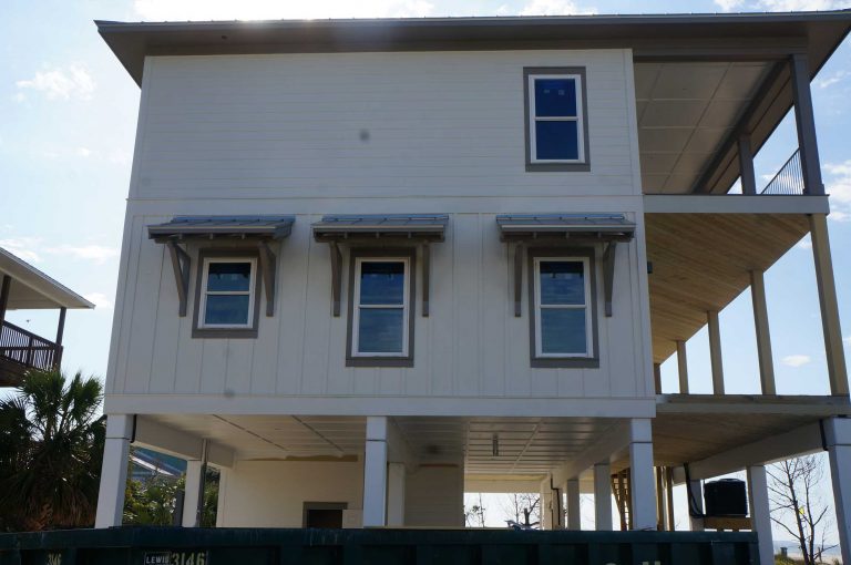 Exterior view of windows with outside shade covers.