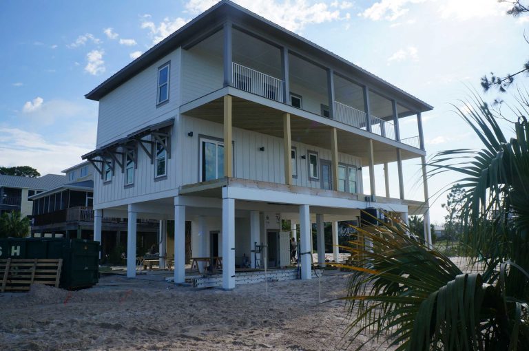 Exterior coastal home under construction.