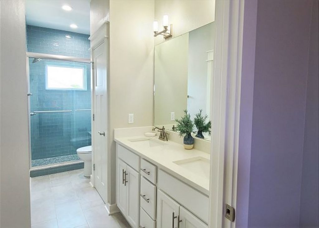 bright bathroom with big shower