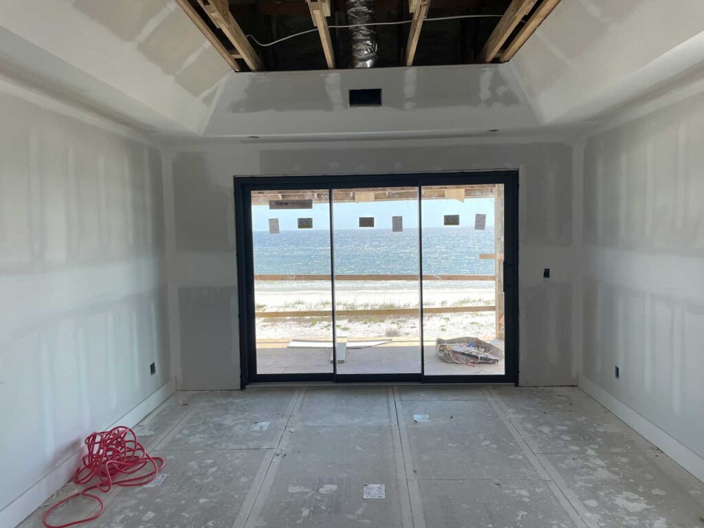 New drywall, ceiling and sliding doors with view of Gulf of Mexico.