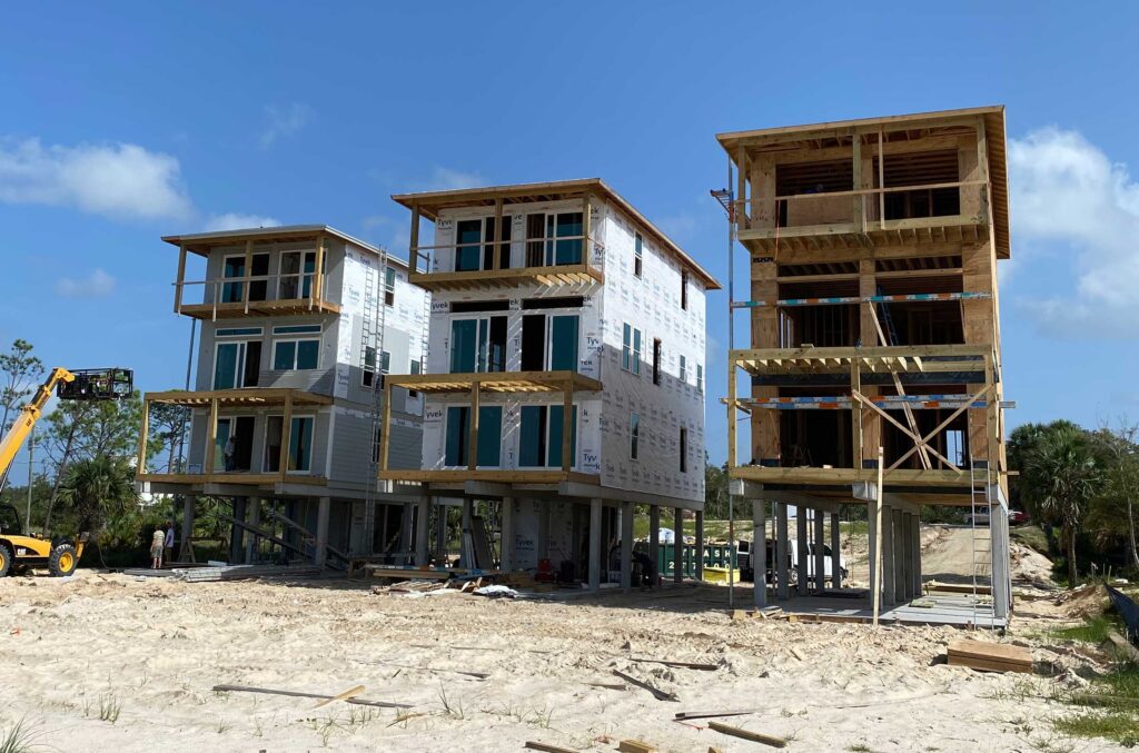 Three new homes under construction in Indian Pass in Northwest Florida. Find home building construction companies near you.